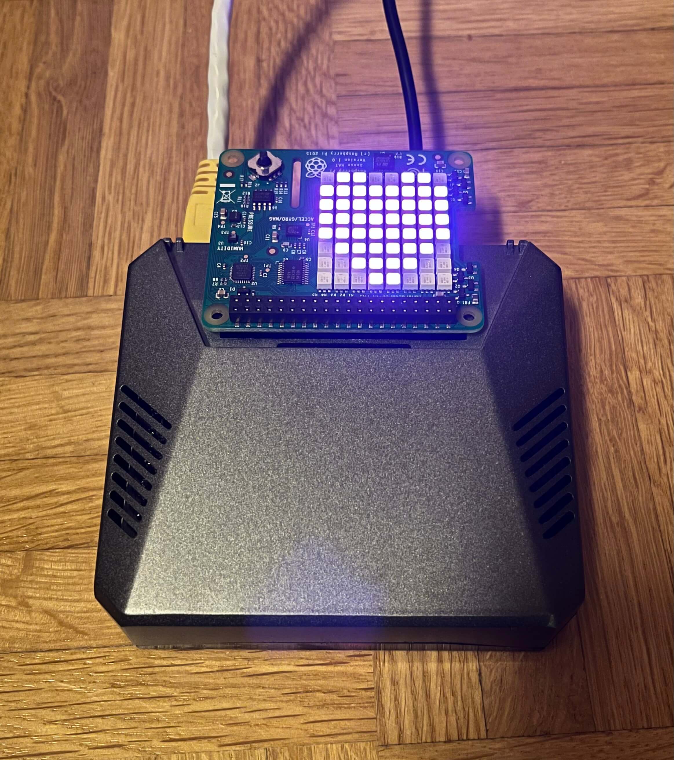 My Raspberry Pi in an Argon V.2 Case from Argon40. On the Top is a sense-HAT showing a purple heart.